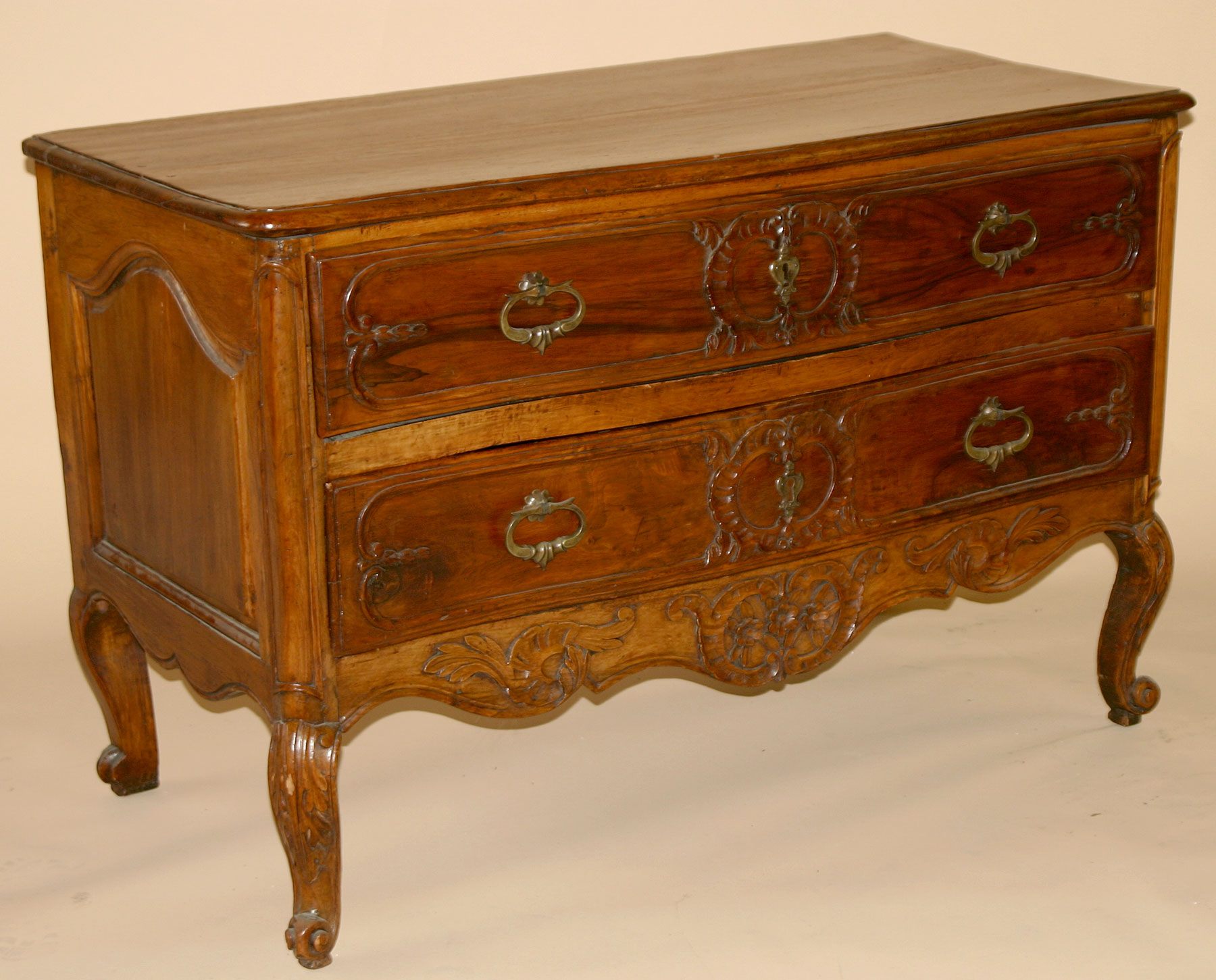 French, 18th century, carved sauteuse (two-drawer Provençal commode)