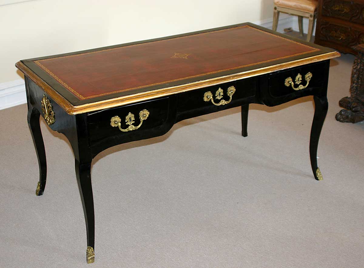 Italian, Regence period, black lacquer and gilt bronze bureau plat