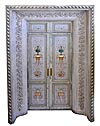 Pair of very fine, rare, late Louis XVI polychrome decorated doors within a door surround